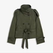 Beige Cath trench coat for women with a structured fit, high collar and dark buttons. Crafted from premium fabric, it highlights the waist and adds refined elegance to any autumn or winter outfit.