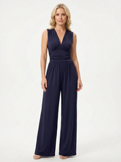 Navy sleeveless jumpsuit with deep V neckline, ruched waist and wide-leg trousers