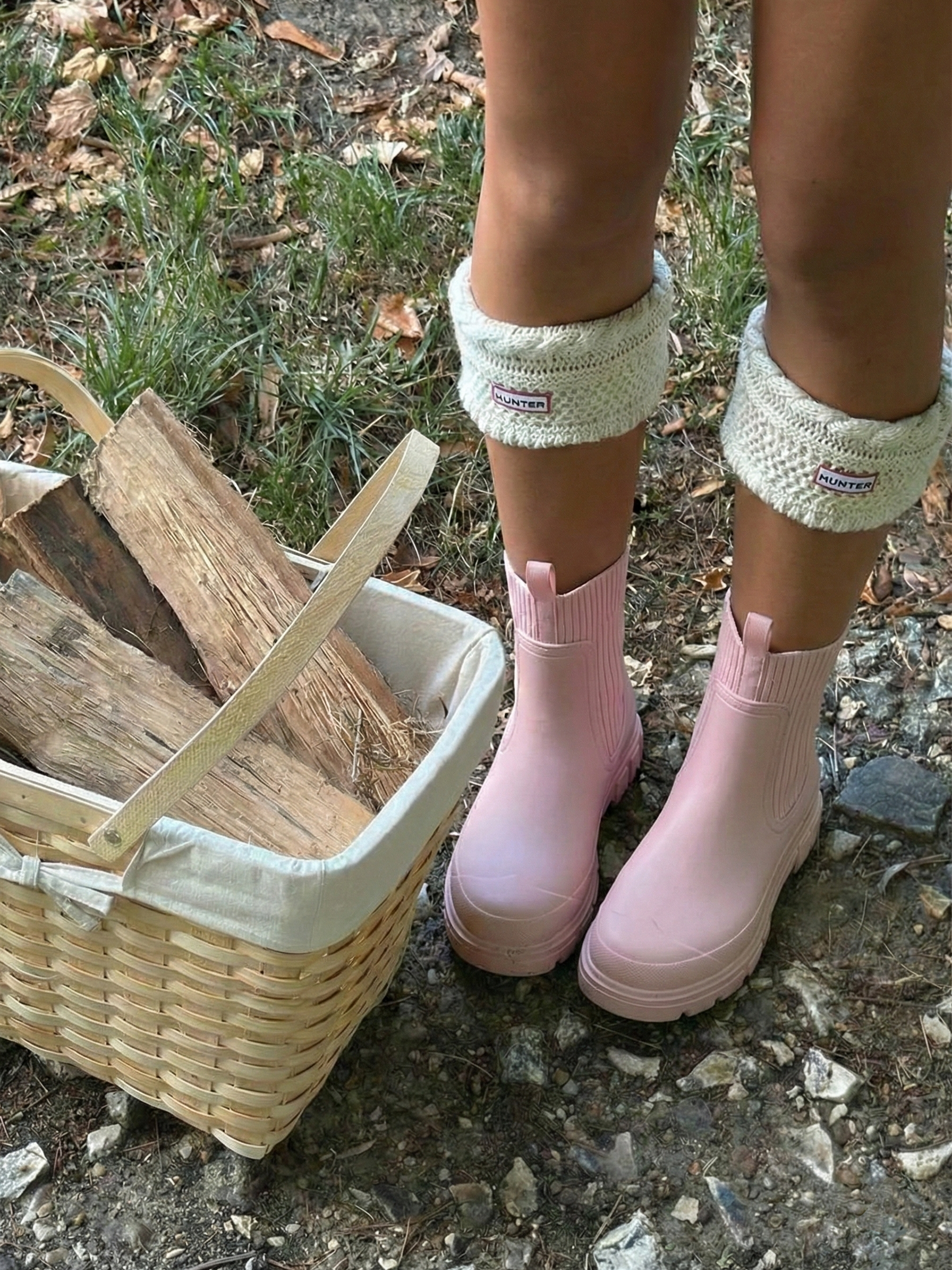 Pink waterproof ankle boot with elastic side panels, pull tabs and chunky lug sole