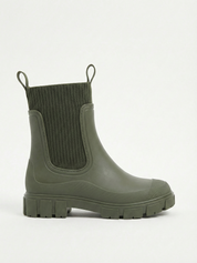 Green waterproof ankle boot with elastic side panels, pull tabs and chunky lug sole