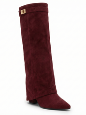 Burgundy knee-high boot with a smooth suede-like finish, pointed toe, discreet low block heel, straight shaft design, and a slim metallic buckle detail at the top.