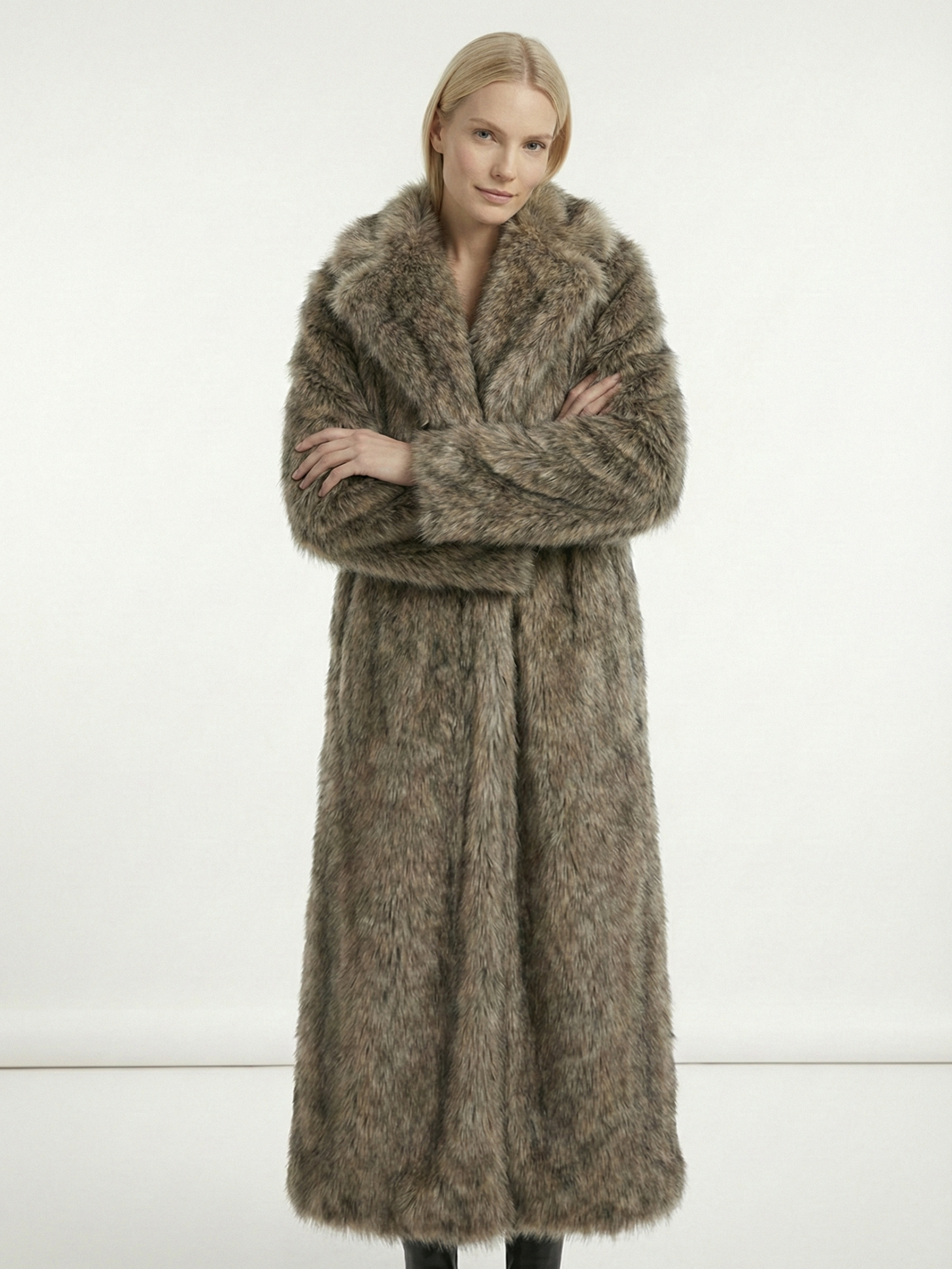 Long faux fur coat in deep brown tones with wide lapel collar and full-length silhouette