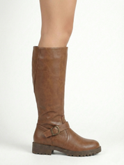 Brown knee-high leather-look boot with side buckle strap, round toe and chunky tread sole, minimalist studio white background.