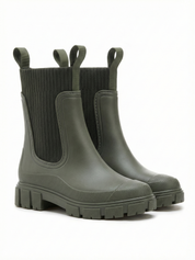 Green waterproof ankle boot with elastic side panels, pull tabs and chunky lug sole