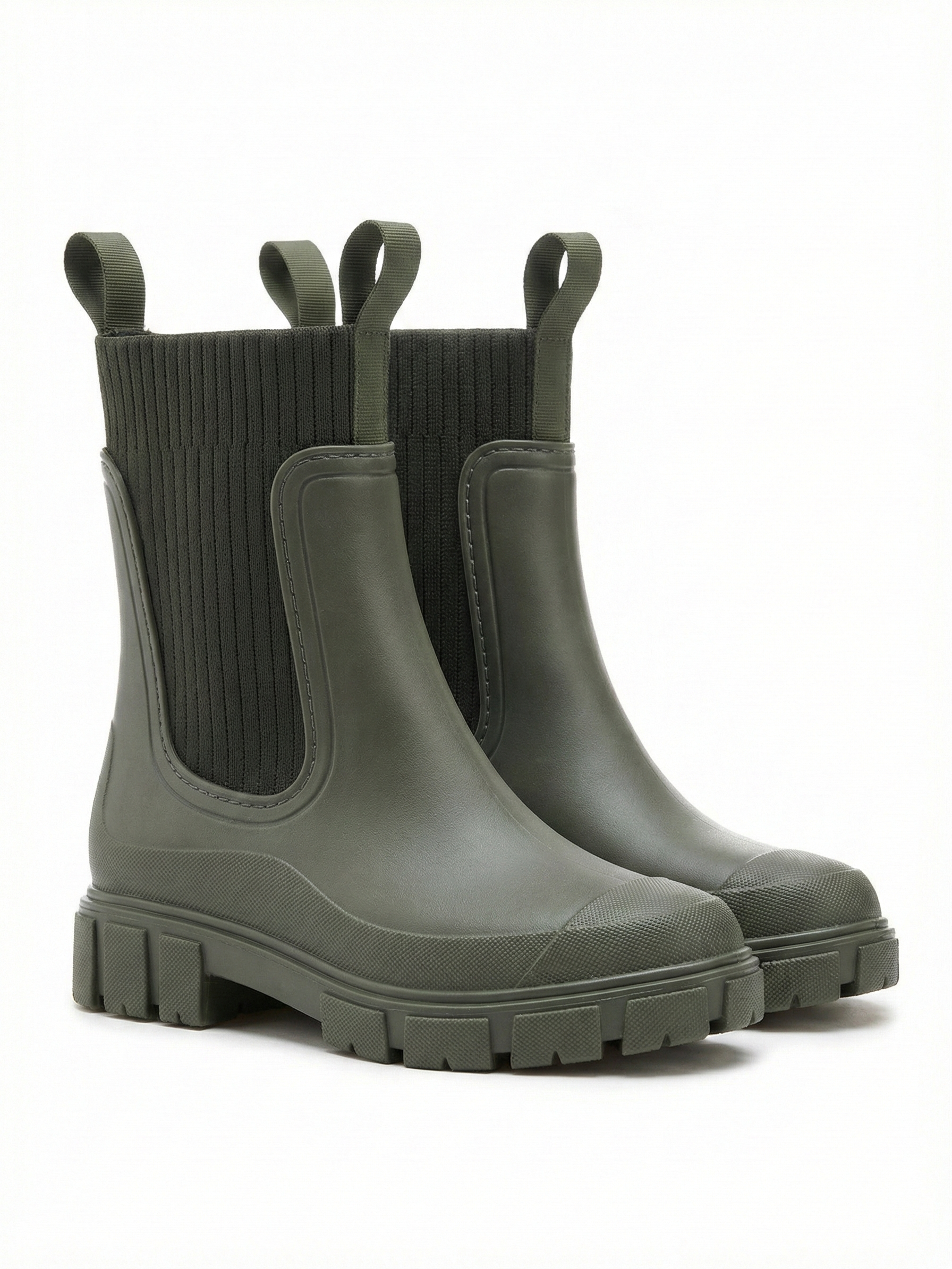 Green waterproof ankle boot with elastic side panels, pull tabs and chunky lug sole