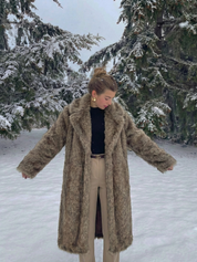 Long faux fur coat in deep brown tones with wide lapel collar and full-length silhouette