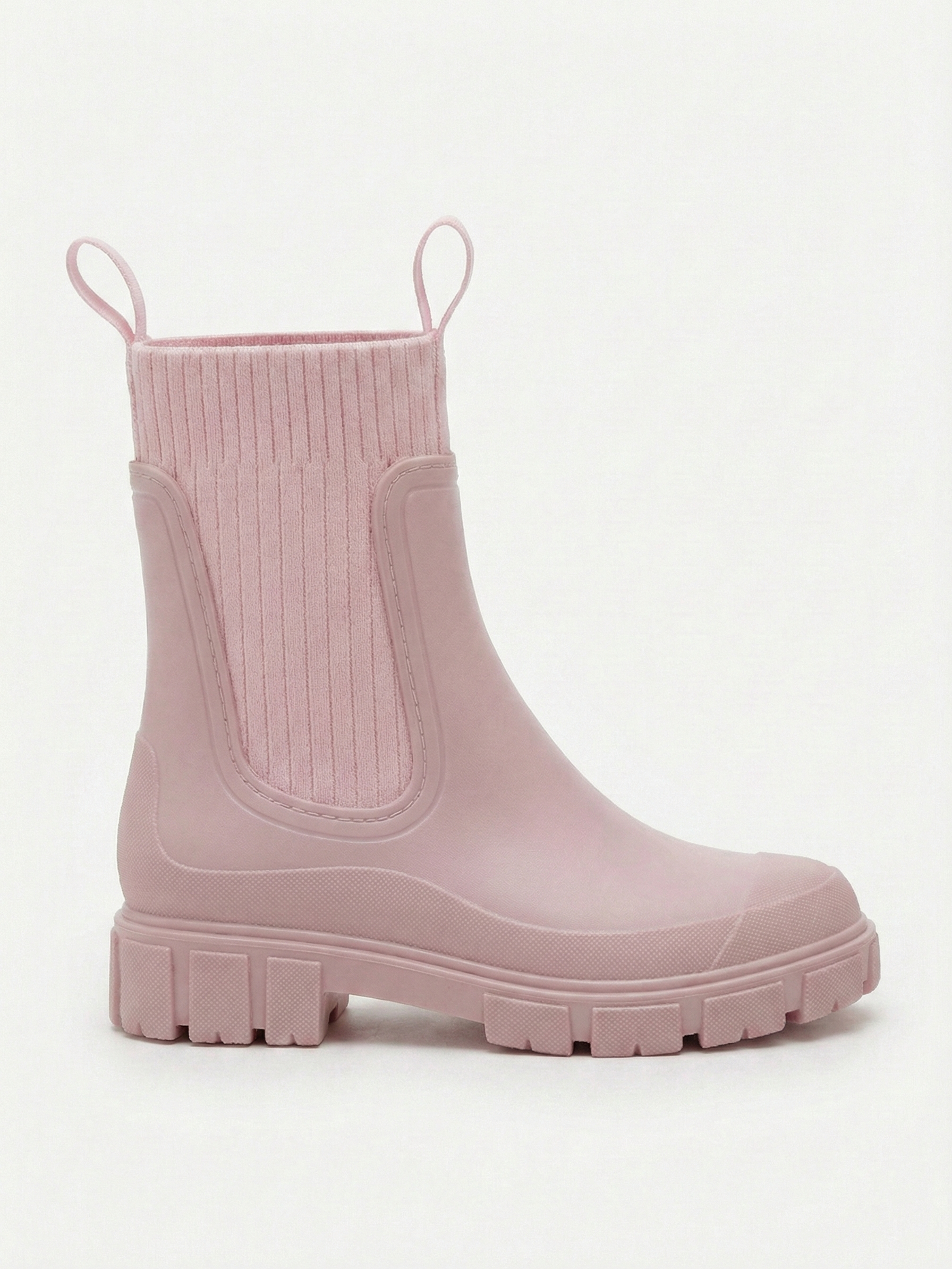 Pink waterproof ankle boot with elastic side panels, pull tabs and chunky lug sole
