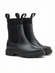 Black waterproof ankle boot with elastic side panels, pull tabs and chunky lug sole