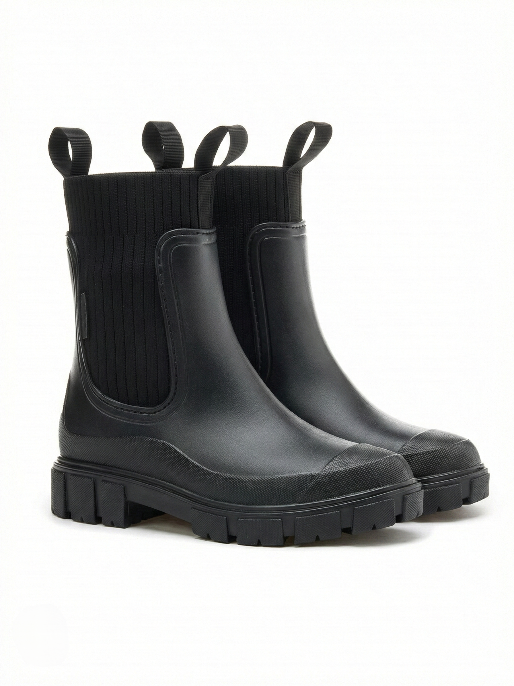 Black waterproof ankle boot with elastic side panels, pull tabs and chunky lug sole