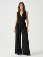 Black sleeveless jumpsuit with deep V neckline, ruched waist and wide-leg trousers