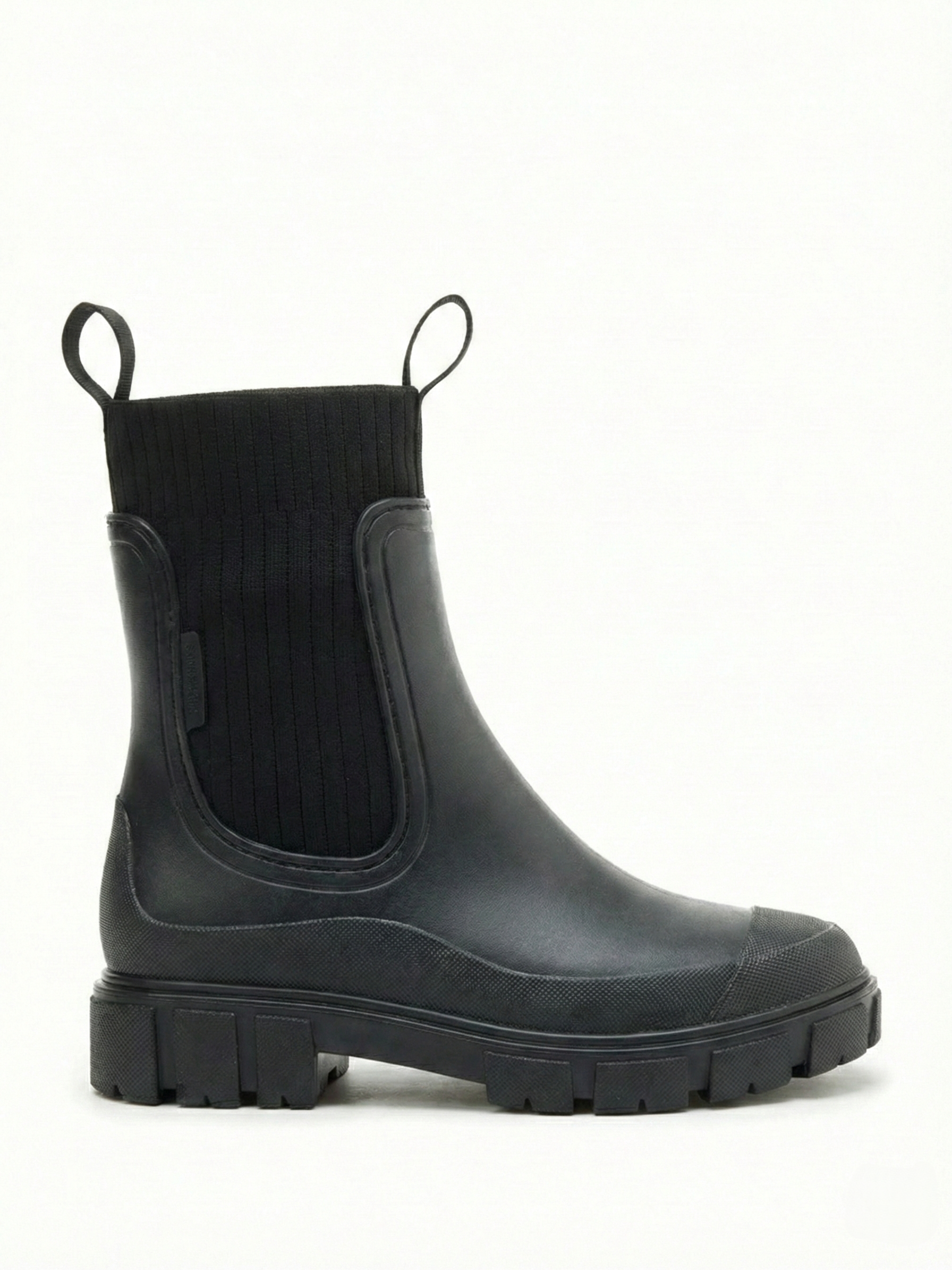 Black waterproof ankle boot with elastic side panels, pull tabs and chunky lug sole
