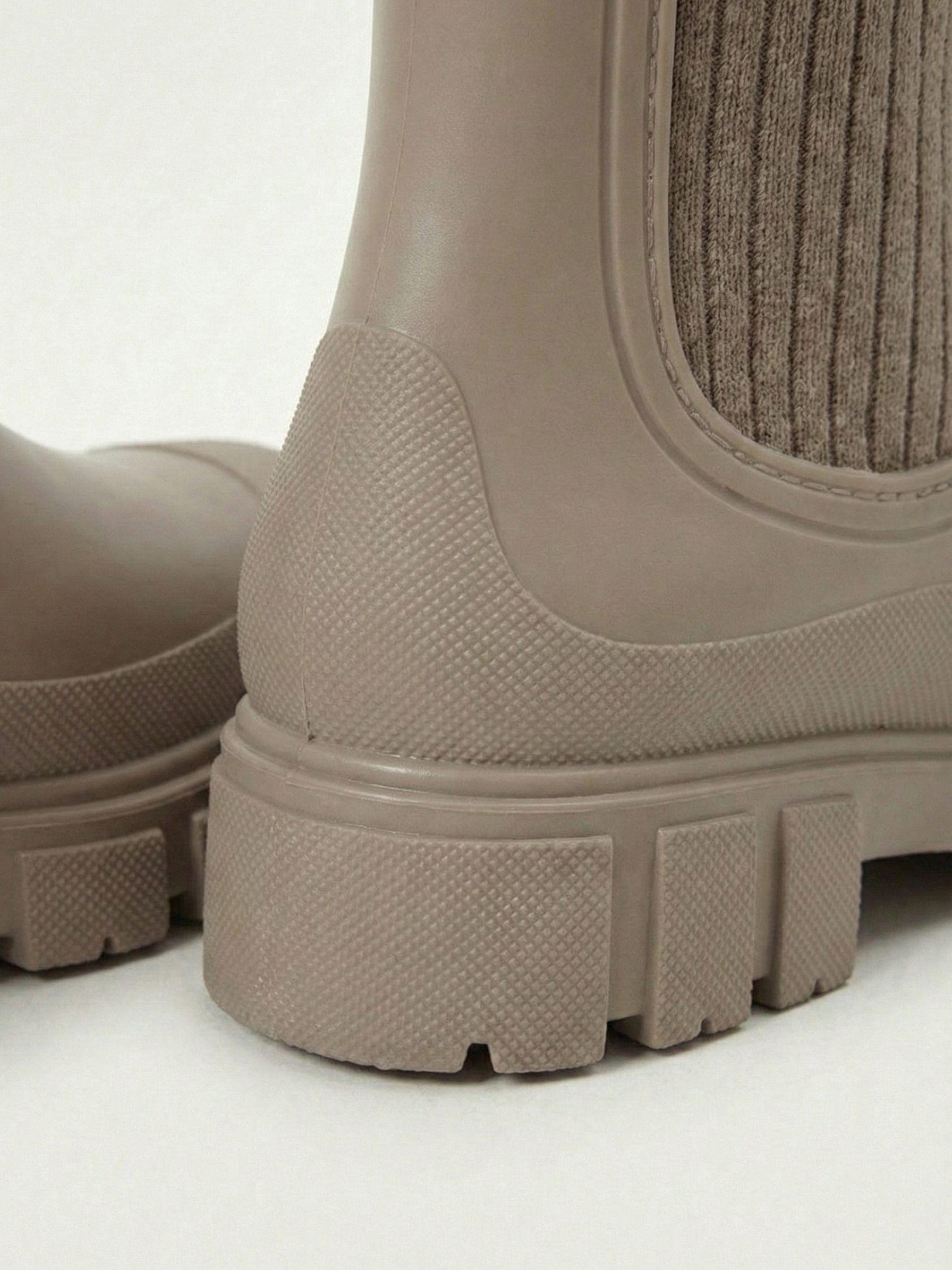 Apricot waterproof ankle boot with elastic side panels, pull tabs and chunky lug sole