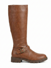 Brown knee-high leather-look boot with side buckle strap, round toe and chunky tread sole, minimalist studio white background.