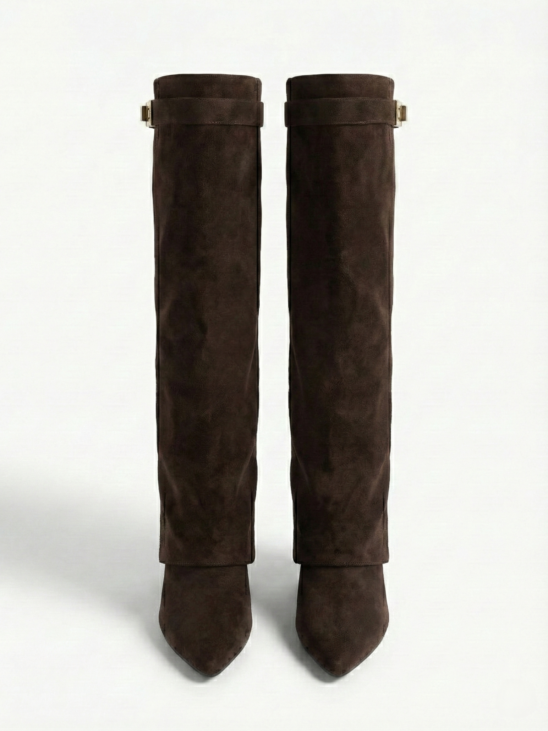 Brown knee-high boot with a smooth suede-like finish, pointed toe, discreet low block heel, straight shaft design, and a slim metallic buckle detail at the top.