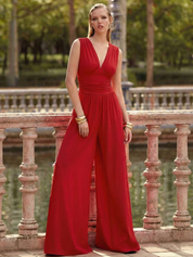 Red sleeveless jumpsuit with deep V neckline, ruched waist and wide-leg trousers