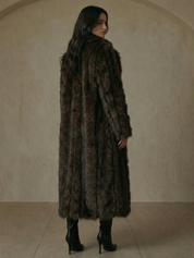 Long faux fur coat in deep brown tones with wide lapel collar and full-length silhouette