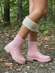 Pink waterproof ankle boot with elastic side panels, pull tabs and chunky lug sole