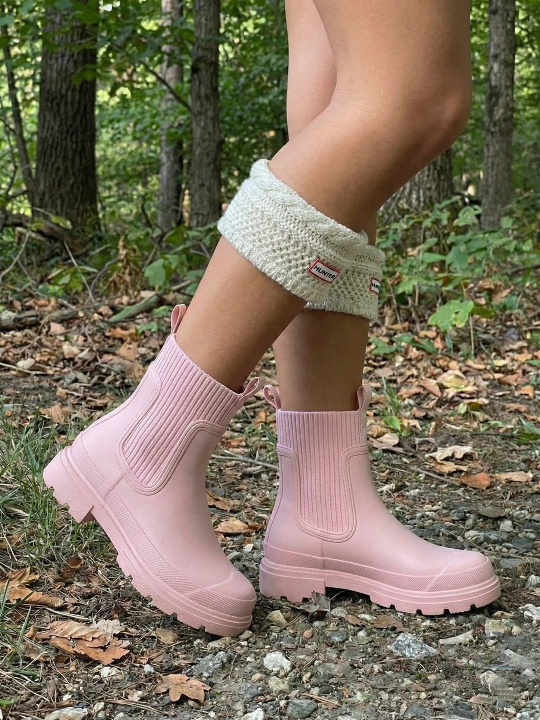 Pink waterproof ankle boot with elastic side panels, pull tabs and chunky lug sole