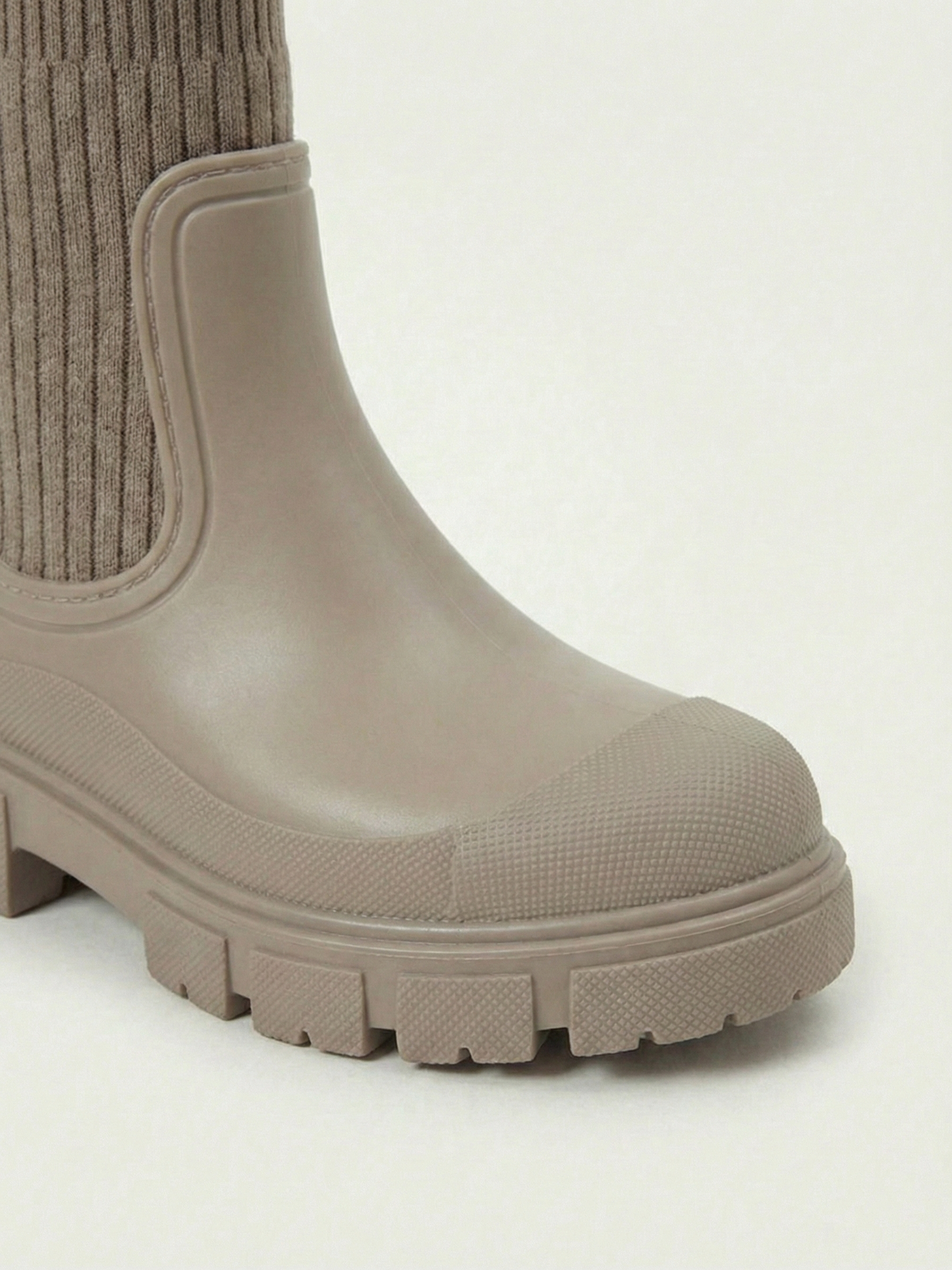 Apricot waterproof ankle boot with elastic side panels, pull tabs and chunky lug sole