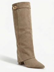 Apricot knee-high boot with a smooth suede-like finish, pointed toe, discreet low block heel, straight shaft design, and a slim metallic buckle detail at the top.