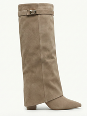 Apricot knee-high boot with a smooth suede-like finish, pointed toe, discreet low block heel, straight shaft design, and a slim metallic buckle detail at the top.